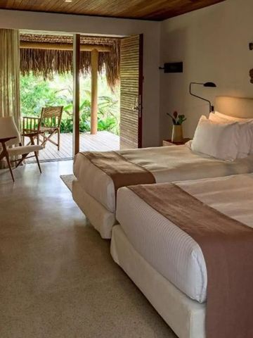 Zweibettzimmer mit Terrassenzugang und natürlichem Licht