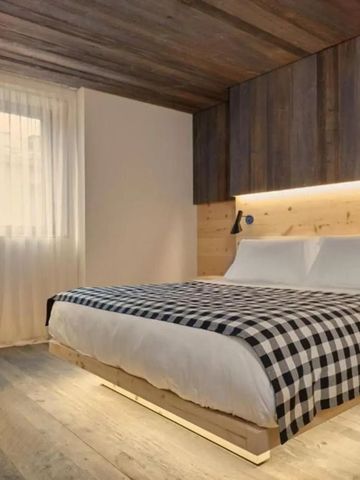 Modernes Schlafzimmer im HOTEL de LEN mit Holzdetails und eleganten Linien