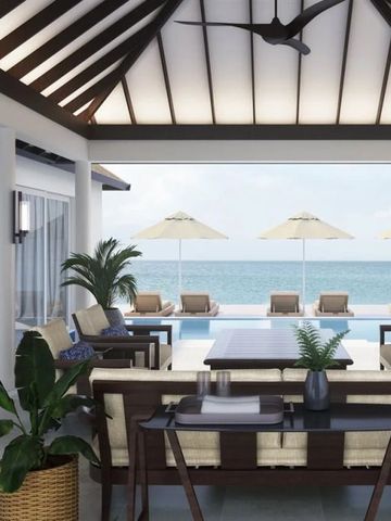 Offener Wohnbereich mit Blick auf den Pool und das Meer im Hintergrund