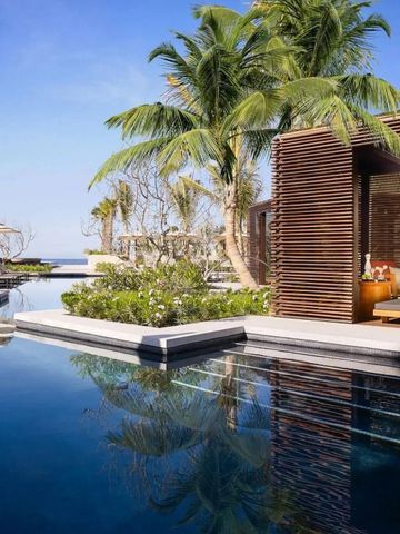 Infinity-Pool umgeben von Palmen im Nobu Hotel Los Cabos