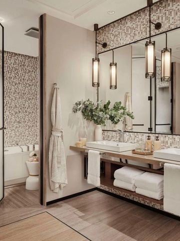 Modernes Bad mit Doppelwaschbecken und stilvoller Dekoration