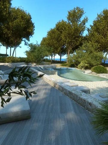 Stylische Terrasse mit Pool und Meerblick inmitten üppiger Vegetation