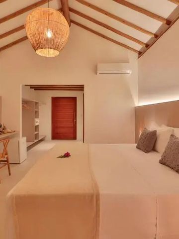 Komfortables Bett mit schöner Beleuchtung im Hotel Pousada Tatuá