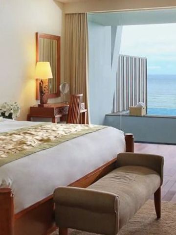 Luxussuite mit Meerblick und elegantem Interieur im Samabe Bali Suites & Villas