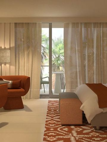 Modern eingerichtetes Hotelzimmer mit Doppelbett, Sessel und Balkon mit Palmenblick
