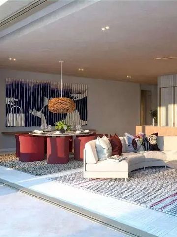 Offenes Wohnzimmer mit modernen Designer-Möbeln und großer Glasfront.