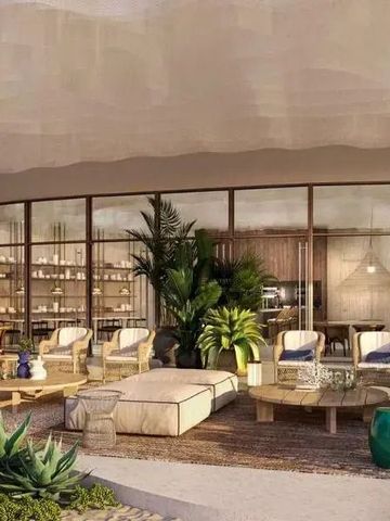 Stilvolle Lounge mit üppiger Begrünung und komfortablen Sitzbereichen.