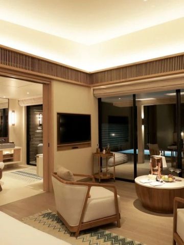 Luxuszimmer mit moderner Einrichtung und Terrasse mit Poolblick