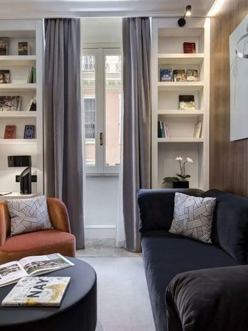 Luxuriöse Sitzecke mit Sofa und Bücherregal in modernem Design, helle Atmosphäre.