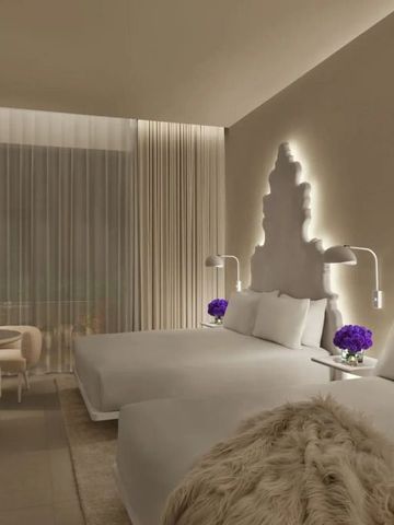 Elegantes Doppelzimmer mit beleuchteter Wandkunst und stilvollen Details.