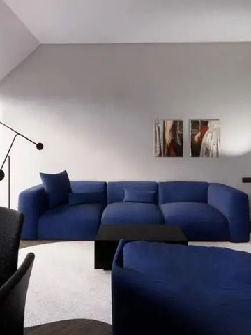 Moderne Suite mit blauen Sofas und eleganter Beleuchtung
