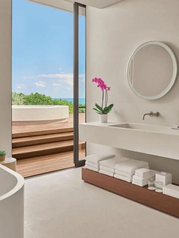 Modernes Badezimmer mit direktem Zugang zur Terrasse und Meerblick im Hotel Riviera Maya Kanai