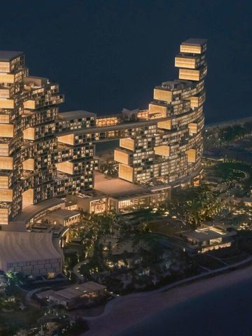 Luftaufnahme des beleuchteten Atlantis The Royal Palm Jumeirah bei Nacht