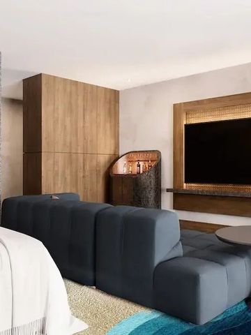 Luxuriöses Hotelzimmer mit modernen Möbeln und großem Fernseher