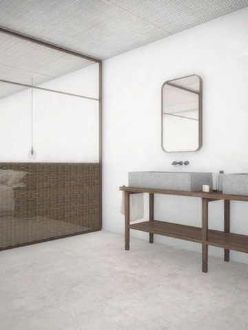 Modernes Hotelzimmer mit minimalistischer Einrichtung und en-suite Badezimmer