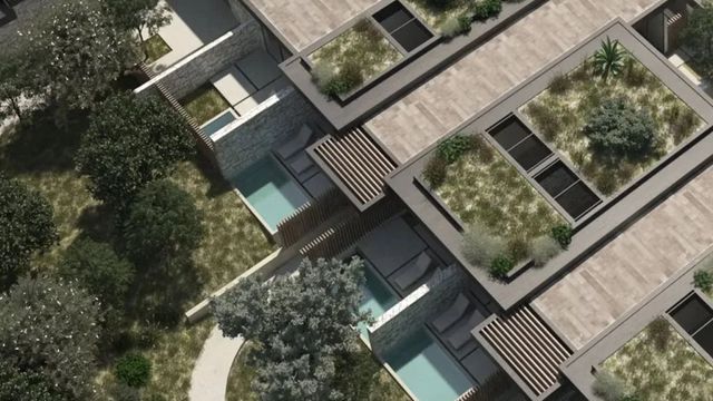 Vogelperspektive auf moderne Hotelarchitektur mit Dachgärten und Pools