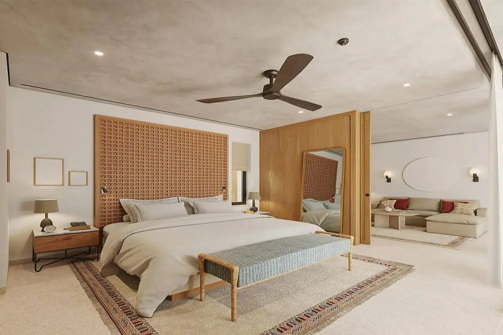 Elegantes Hotelzimmer mit großem Bett, Sitzbereich und moderner Dekoration