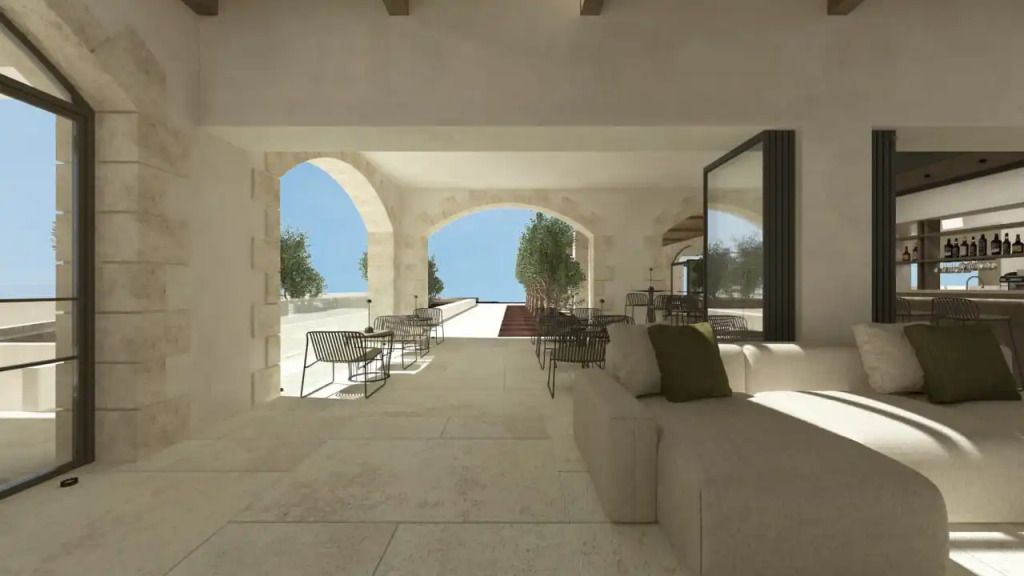 Eleganter überdachter Außenbereich mit Blick aufs Meer und stilvollen Sitzgelegenheiten